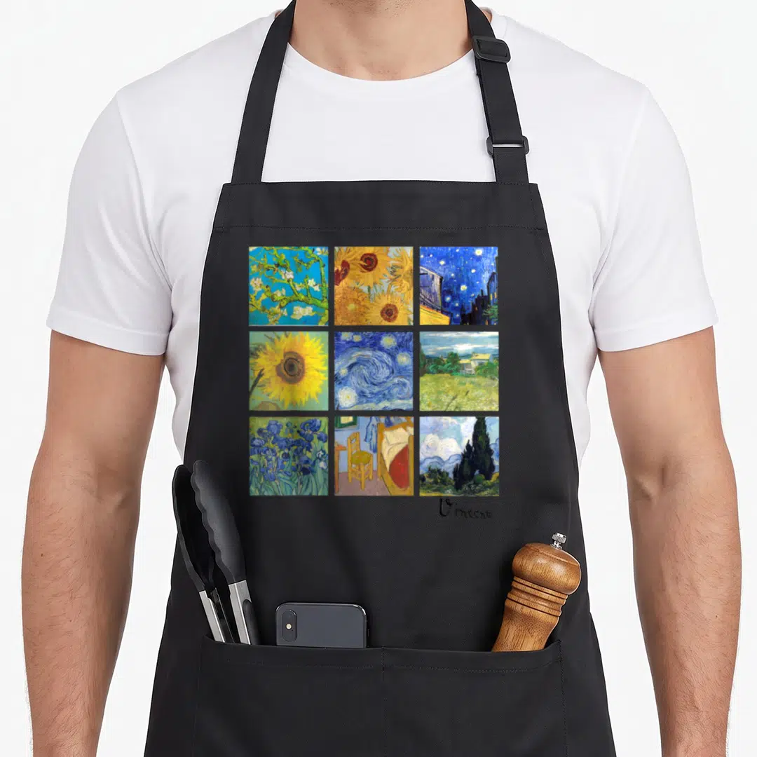 Van sunflower apron - Nine square paintings in yellow blue green grid with Vincent script signature below — shown on a black cotton canvas apron against a white background