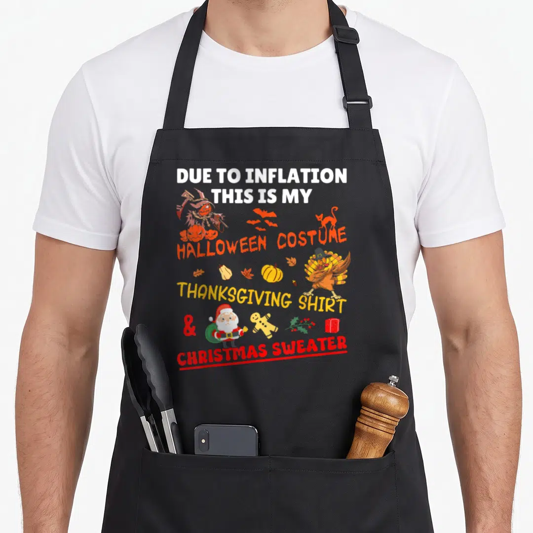 Due xmas apron - Stacked text reading Due To Inflation Halloween Costume Thanksgiving Shirt Christmas Sweater — shown on a black cotton canvas apron against a white background