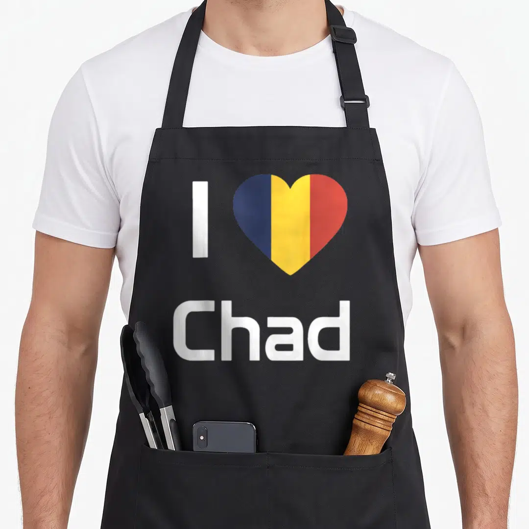 Flag chad apron - White I and Chad text with blue yellow red striped heart on black background — shown on a black cotton canvas apron against a white background
