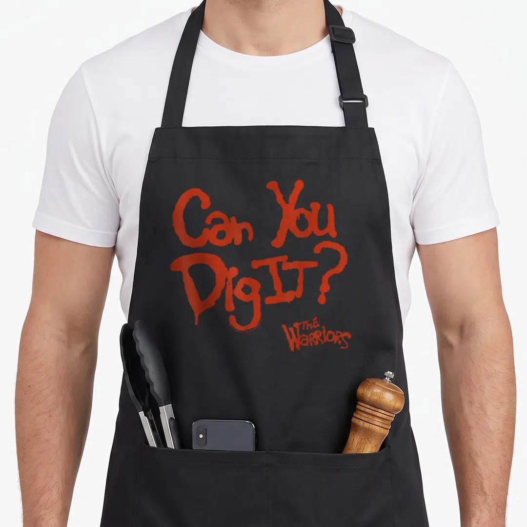 Dig warrior apron - Red stacked text reading Can You Dig It The Warriors — shown on a black cotton canvas apron against a white background