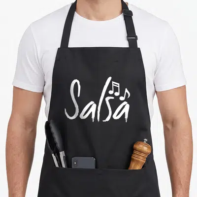 Dance pico de gallo apron - White brush script Salsa text with two musical notes on black fabric — shown on a black cotton canvas apron against a white background