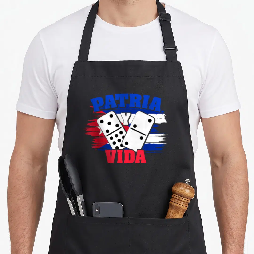 Patria libra girl apron - PATRIA Y VIDA text over two dominoes and distressed Cuban flag in blue white red — shown on a black cotton canvas apron against a white background