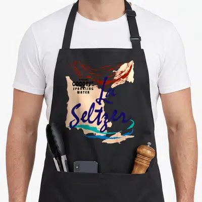 Seltzer halloween apron - La Seltzer script over natural coconut sparkling water text with abstract blue red peach teal — shown on a black cotton canvas apron against a white background