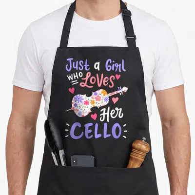 Cute cellist cello apron - Floral cello silhouette surrounded by purple pink and white text and hearts — shown on a black cotton canvas apron against a white background
