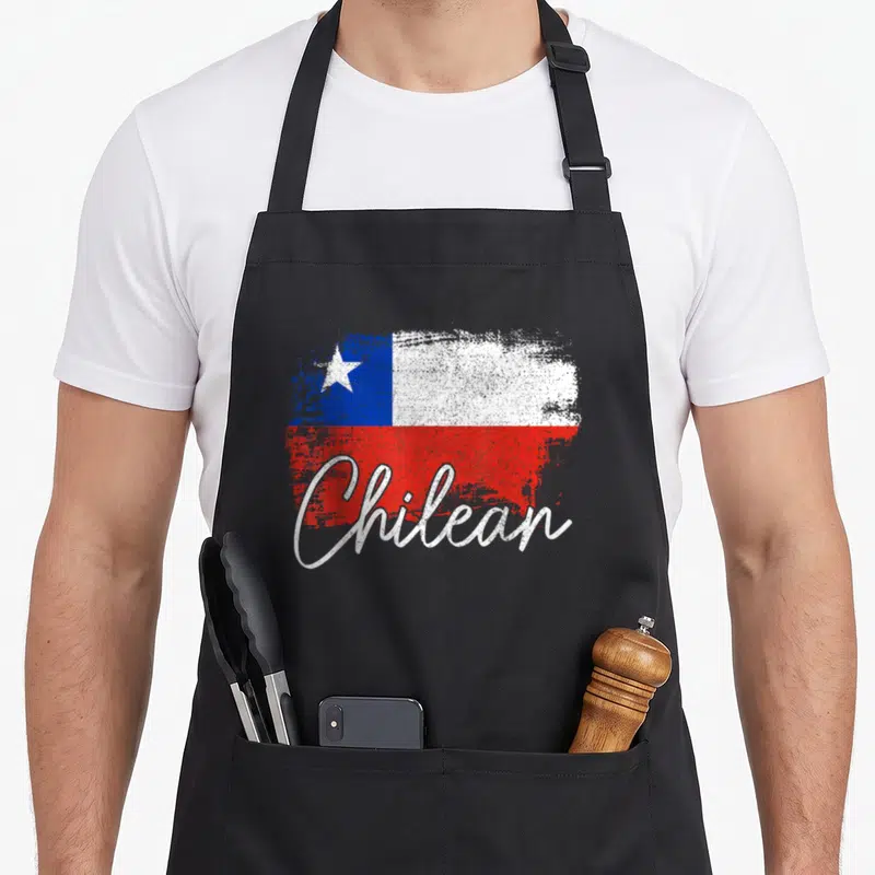 Chile flag pride apron - Distressed Chilean flag with white script text in red white and blue — shown on a black cotton canvas apron against a white background