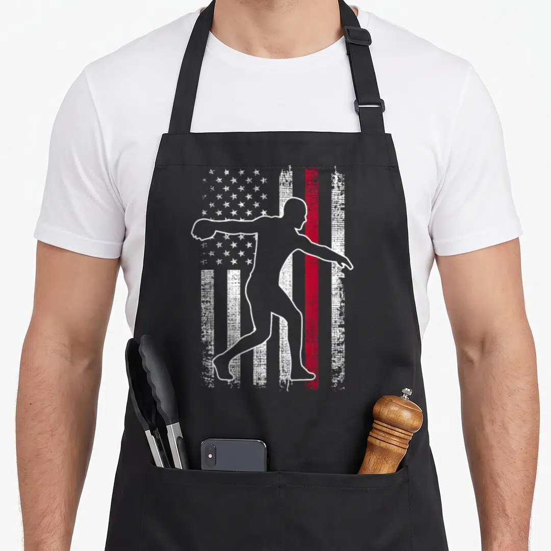 Discus 4th of july apron - White outline of discus thrower over distressed flag with red stripe — shown on a black cotton canvas apron against a white background