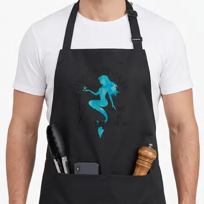 Aqua mermaid apron - Blue watercolor mermaid holding a yellow starfish with black text reading BEACH PLEASE... I'm — shown on a black cotton canvas apron against a white background