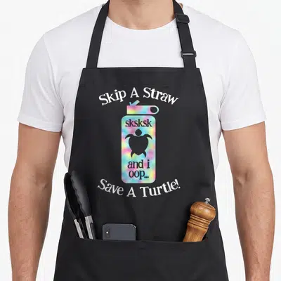 Sksksk turtle lady apron - Tie-dye water bottle with turtle silhouette and Skip A Straw text — shown on a black cotton canvas apron against a white background
