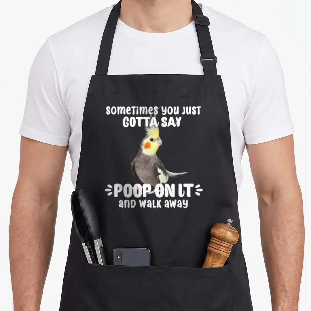 Poop i love my cockatiel apron - Cockatiel photo between white text saying sometimes you just gotta say poop on it — shown on a black cotton canvas apron against a white background