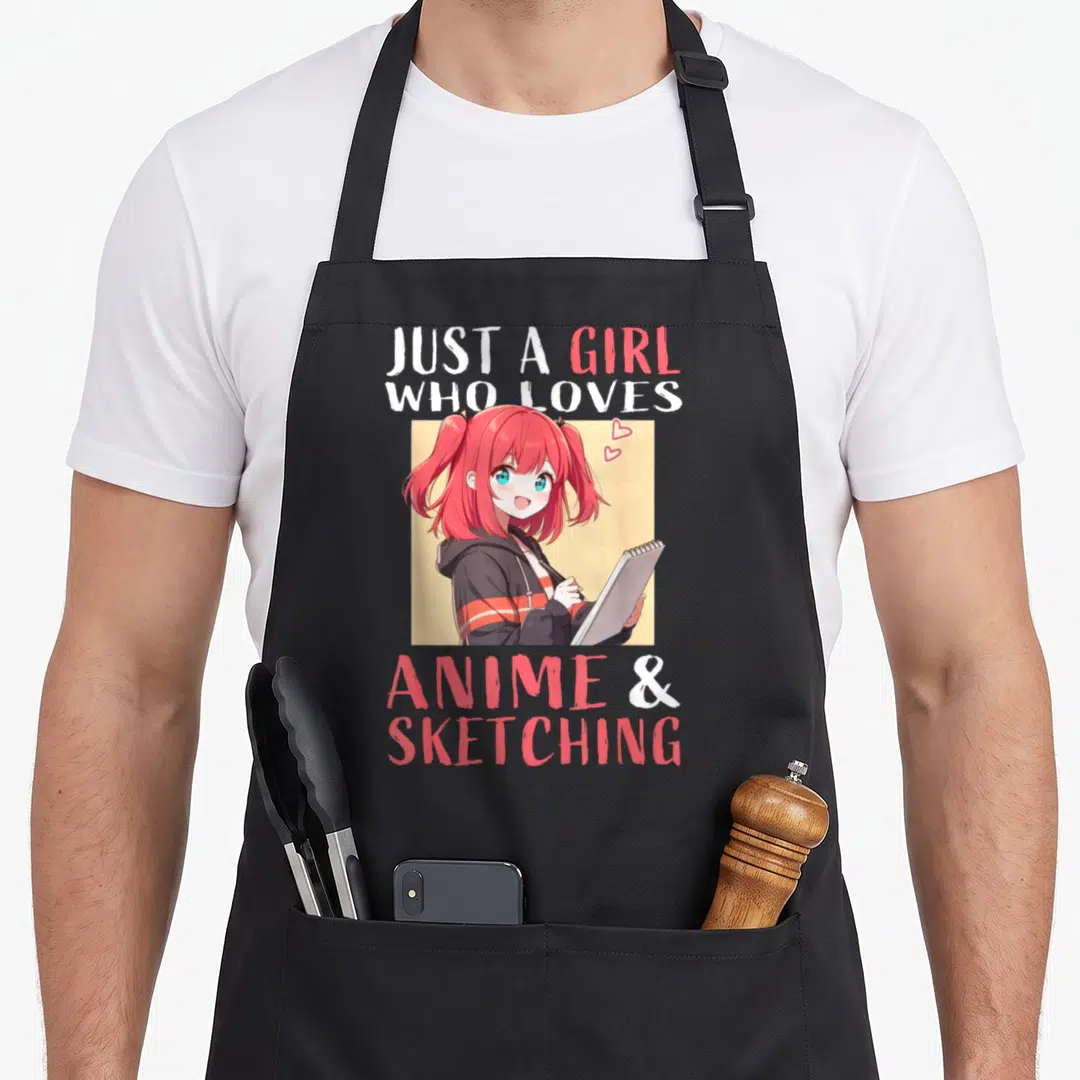 Anime sketching japan apron - Pink hair anime girl holding sketchbook surrounded by Just A Girl Who Loves Anime & — shown on a black cotton canvas apron against a white background
