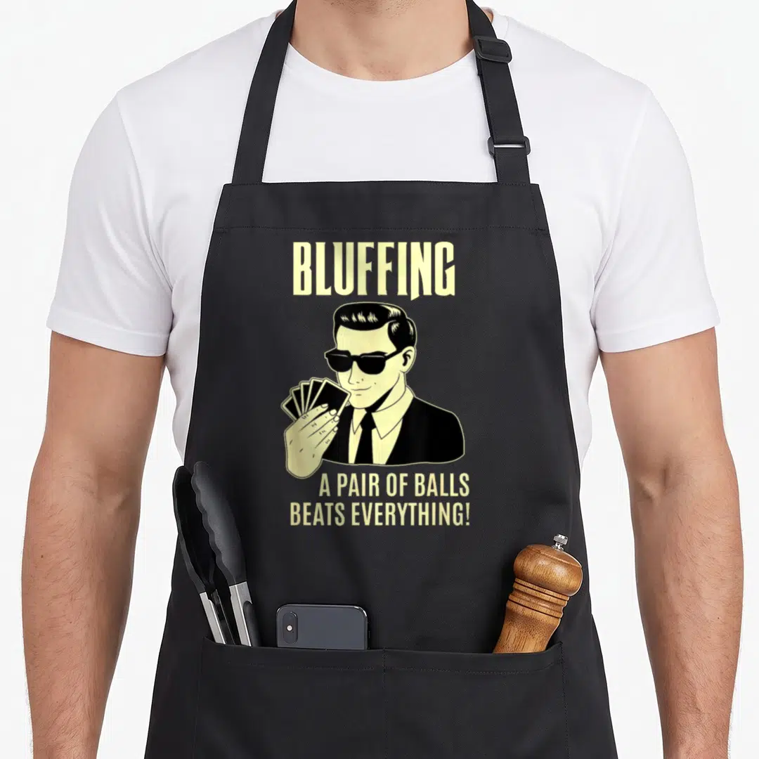 Card texas apron - Cartoon man in sunglasses holding cards with bluffing text — shown on a black cotton canvas apron against a white background
