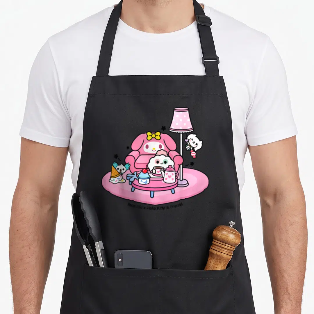 Toca tea party aprons - Cartoon characters at a pink tea party with armchair, lamp, and table — shown on a black cotton canvas apron against a white background