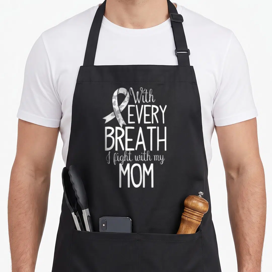 Lung ribbon mom apron - White and grey awareness ribbon with butterfly pattern and stacked typography text — shown on a black cotton canvas apron against a white background