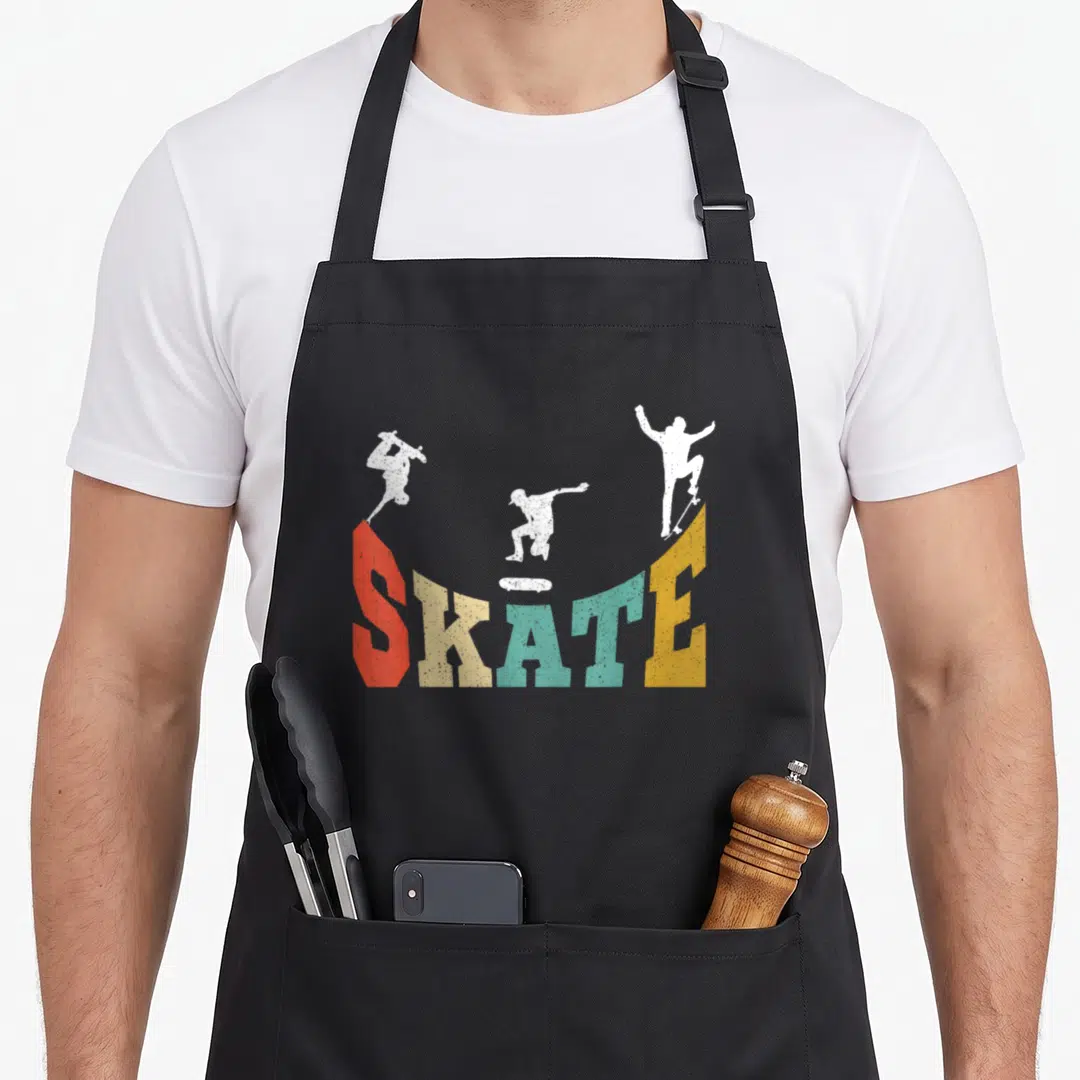 Stunt best skater skateboarder accessories stuff apron - Three white skater silhouettes above a colorful distressed — shown on a black cotton canvas apron against a white background