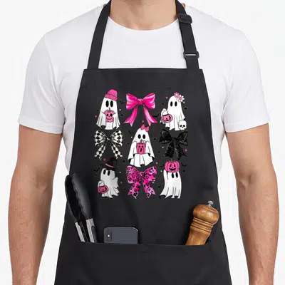 Scary bow apron - Cartoon ghosts holding pink pumpkins mixed with checkered and leopard print bows — shown on a black cotton canvas apron against a white background