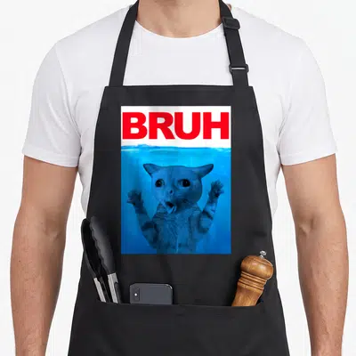Brother cat apron - Red BRUH text above a blue-tinted photo of a submerged cat with raised paws — shown on a black cotton canvas apron against a white background