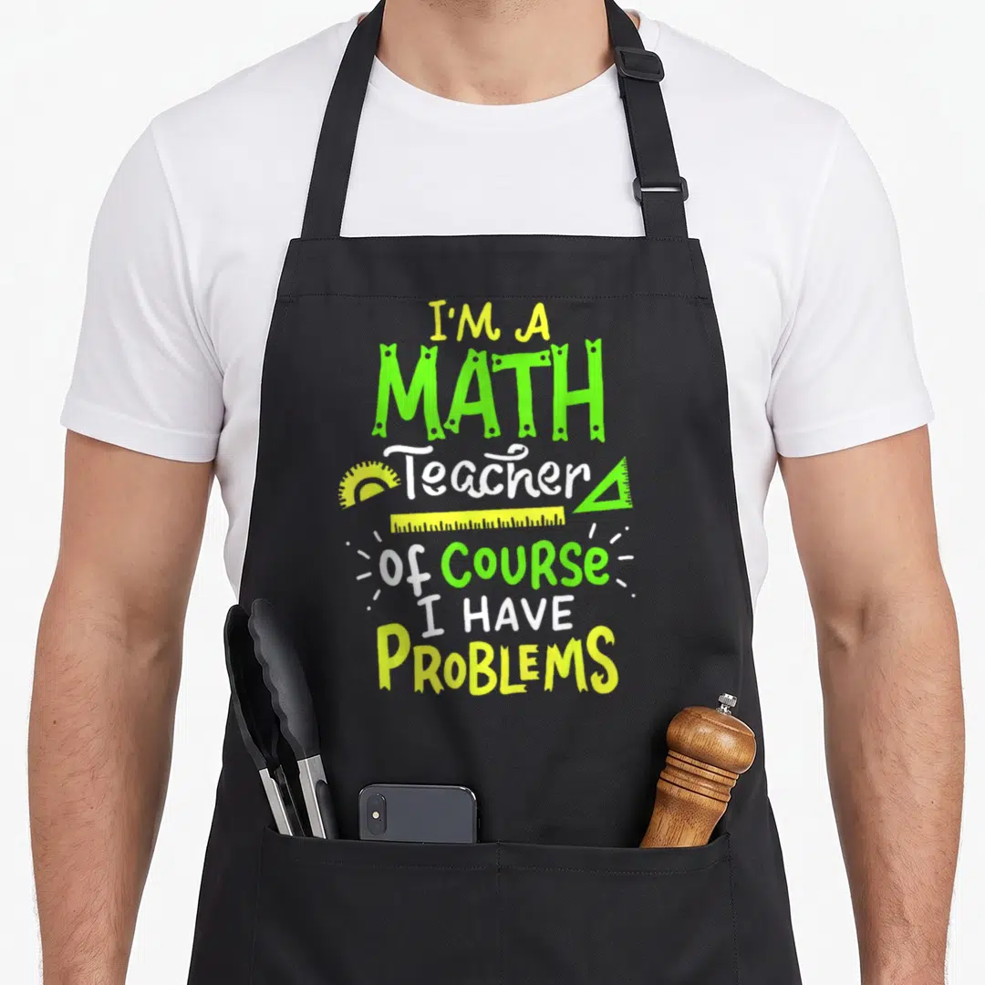 Class teacher apron - Stacked text I'M A MATH Teacher with protractor triangle ruler and straight ruler in lime green — shown on a black cotton canvas apron against a white background