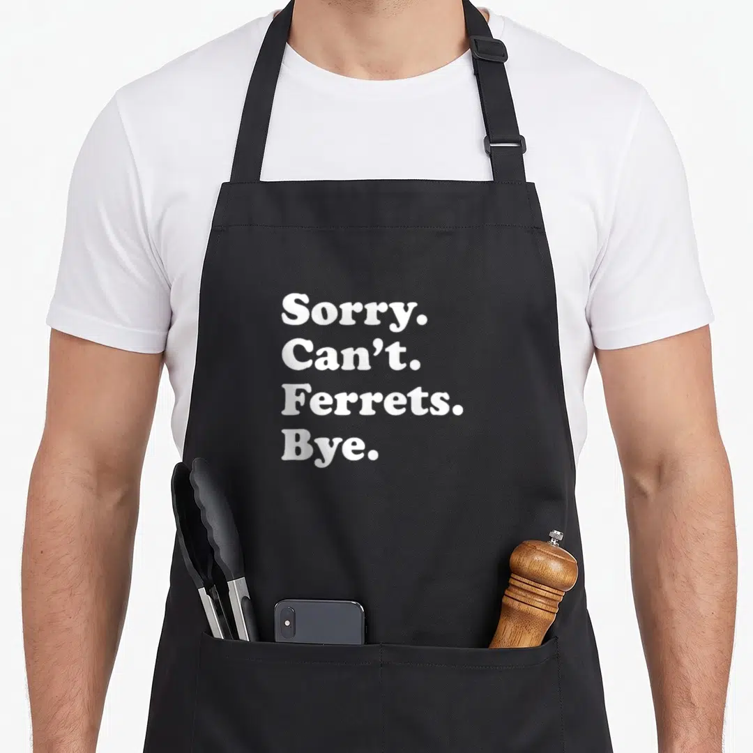 Ferret apron or apron - White stacked text reading Sorry Can't Ferrets Bye on grey background — shown on a black cotton canvas apron against a white background