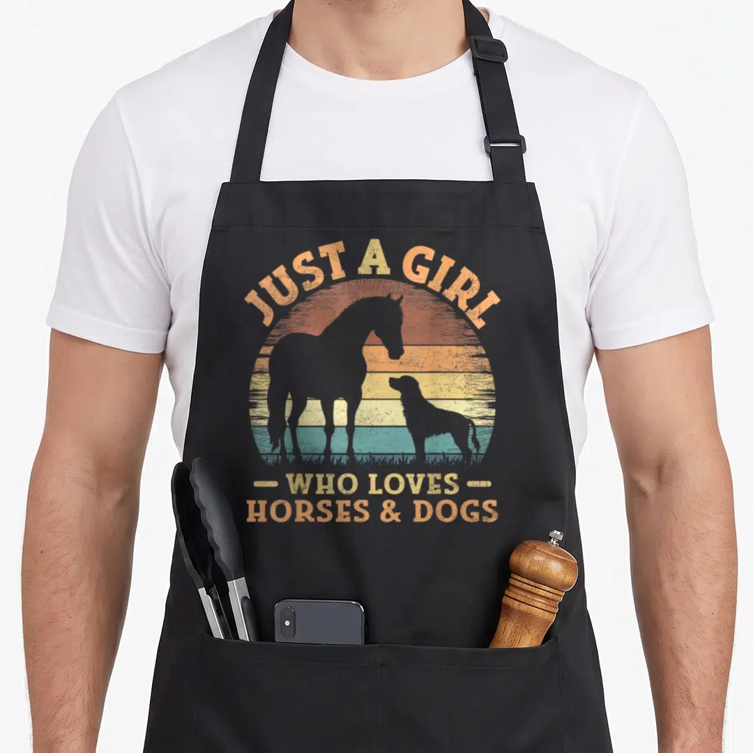 Dog animal horse apron - Retro striped sun with horse and dog silhouettes and text JUST A GIRL WHO LOVES HORSES & DOGS — shown on a black cotton canvas apron against a white background