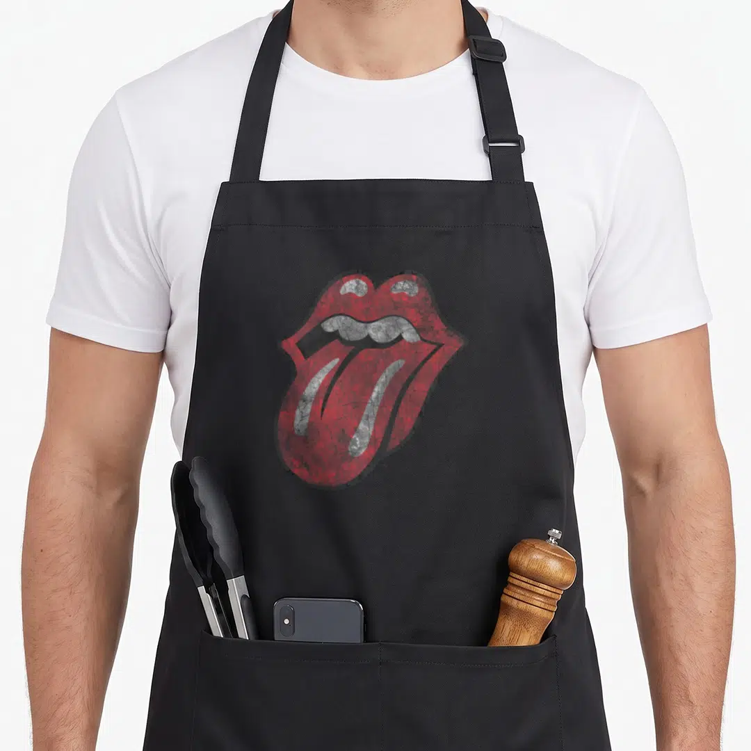 Distressed rolling stones apron - Red and grey distressed mouth with protruding tongue centered on canvas — shown on a black cotton canvas apron against a white background