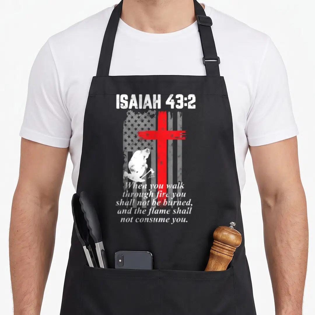 Thin bible verse apron - Red cross over grey flag with kneeling man and Isaiah 43:2 text — shown on a black cotton canvas apron against a white background