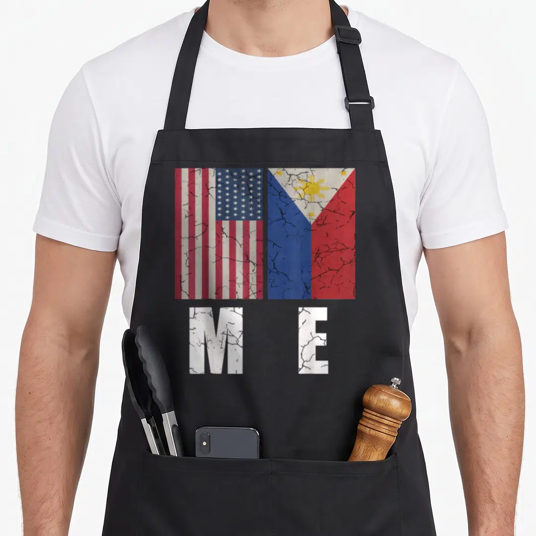 Filipino pride american flag apron - Two distressed flags above white M E letters in red white blue and yellow — shown on a black cotton canvas apron against a white background