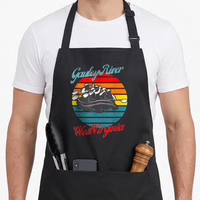 West gauley river apron - Retro striped sun with rafters silhouette and text Gauley River West Virginia — shown on a black cotton canvas apron against a white background