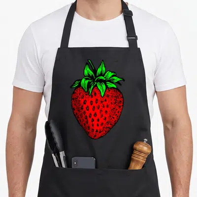 Funny strawberry apron - Red strawberry with green leaves and black outline in line art style — shown on a black cotton canvas apron against a white background