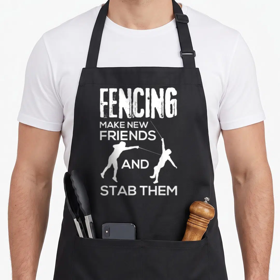 Friend fencing apron - White stacked text reading FENCING MAKE NEW FRIENDS AND STAB THEM between two fencer silhouettes — shown on a black cotton canvas apron against a white background