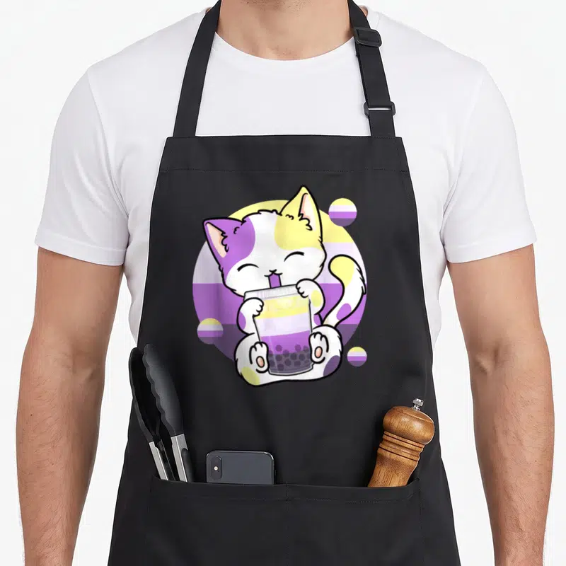 Bubble cat apron - Cartoon cat drinking bubble tea with purple yellow white striped circles — shown on a black cotton canvas apron against a white background