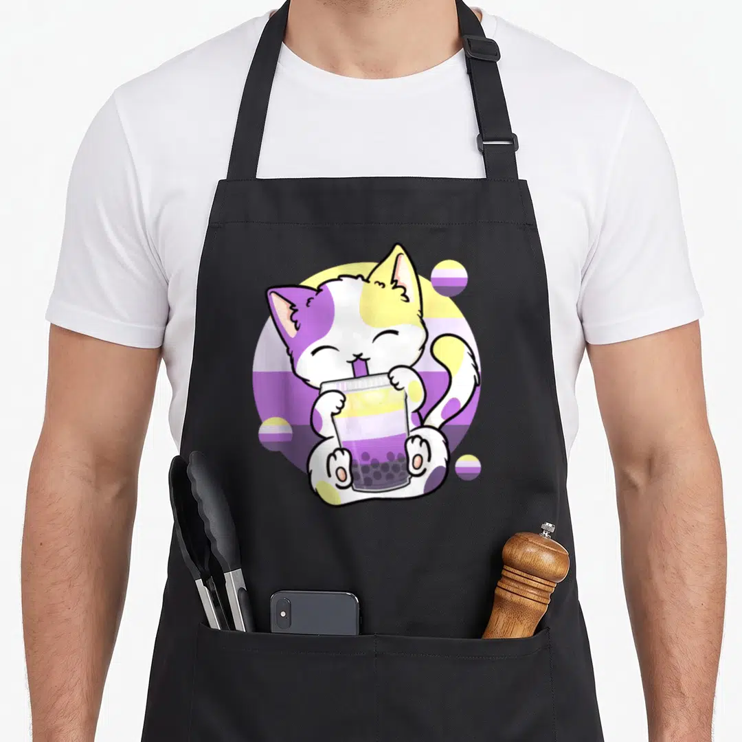 Bubble cat apron - Cartoon cat drinking bubble tea with purple yellow white striped circles — shown on a black cotton canvas apron against a white background