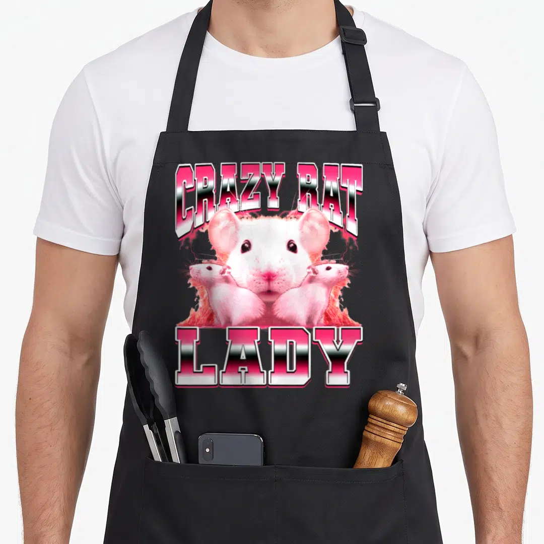 Mouse 90s apron - CRAZY RAT LADY text with three realistic white rats in pink and white gradients — shown on a black cotton canvas apron against a white background