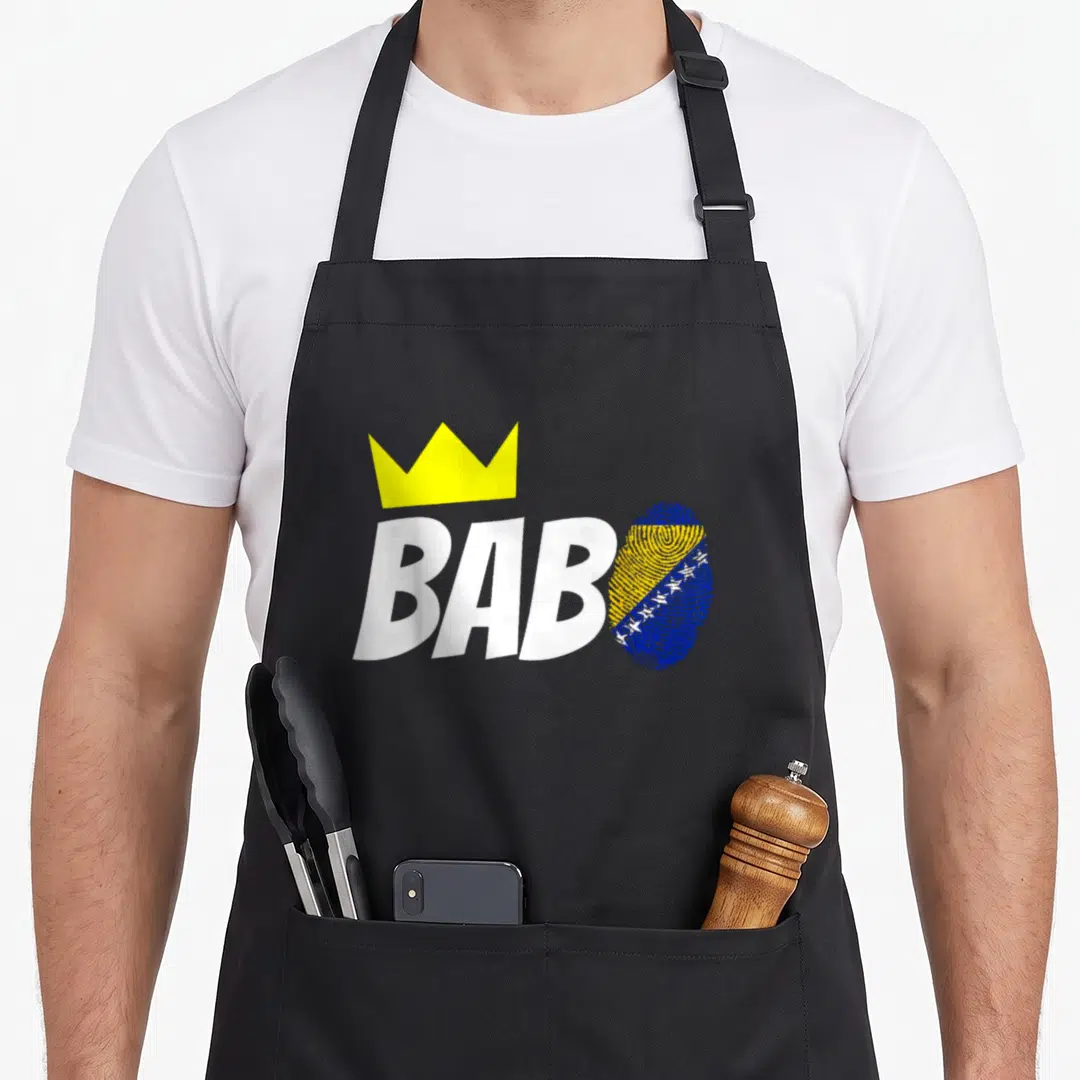 Bosnia birthday apron - BABO text with yellow crown and fingerprint filled with blue and yellow flag pattern — shown on a black cotton canvas apron against a white background