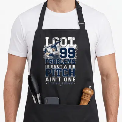 Pitch new york apron - I GOT 99 PROBLEMS BUT A PITCH AIN'T ONE Aaron Judge baseball player navy white distressed — shown on a black cotton canvas apron against a white background