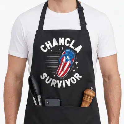 Survivor spanish aprons - Cartoon flip flop with red white and blue stripes and stars arched by chancla survivor text — shown on a black cotton canvas apron against a white background