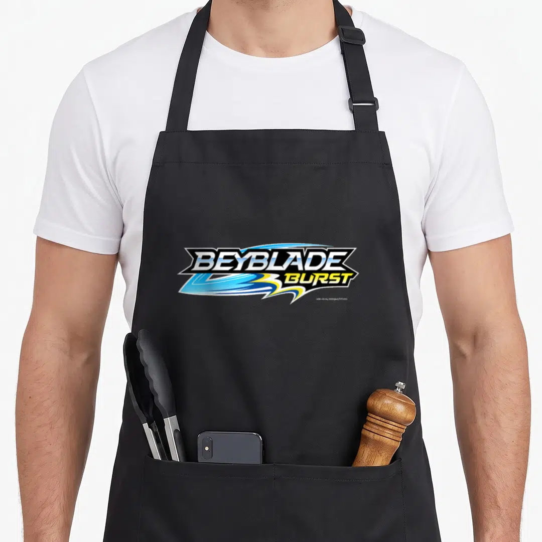 Burst crew apron - Beyblade Burst logo with blue and yellow swooshes wrapping around white text — shown on a black cotton canvas apron against a white background