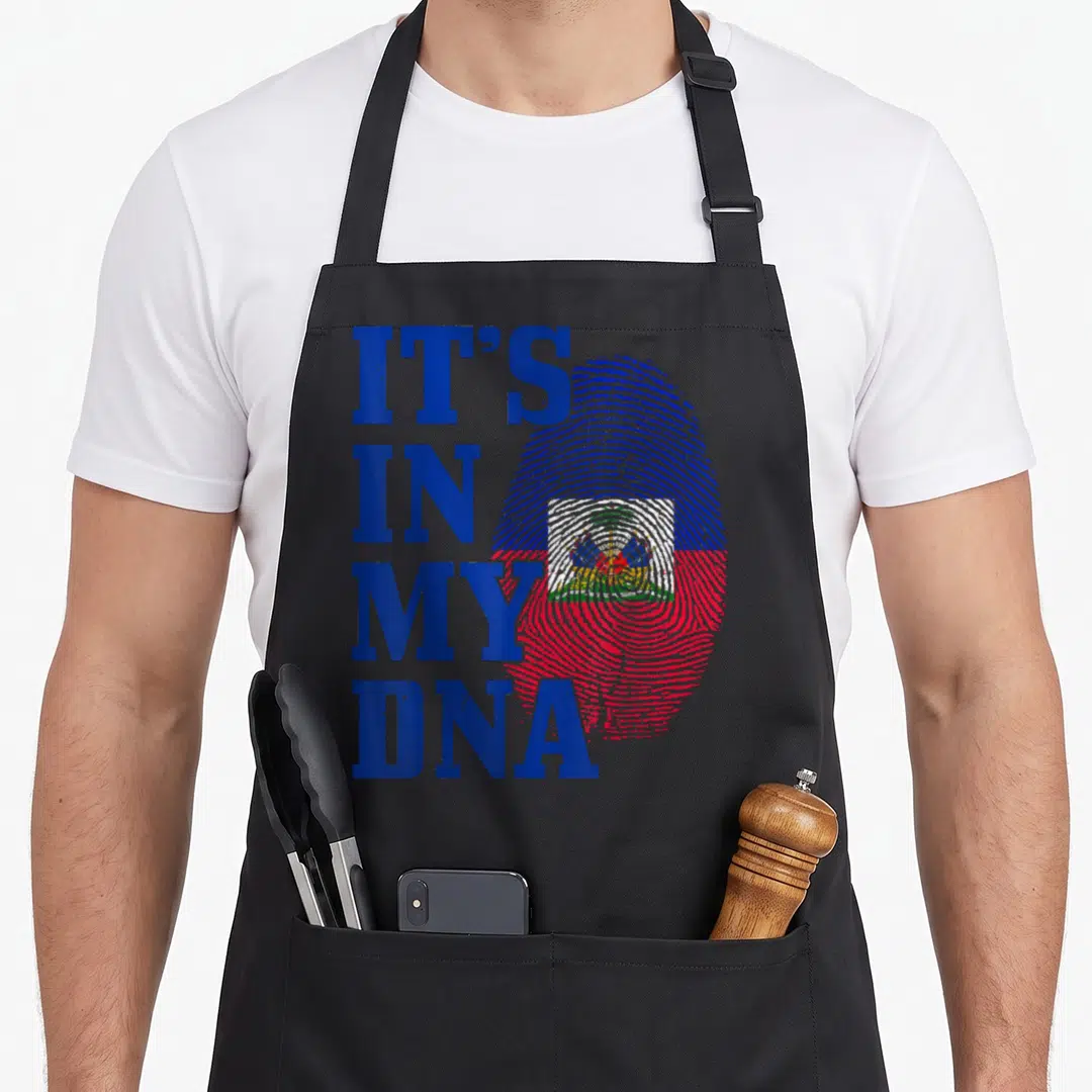 Dna fingerprint pride apron - Stacked IT'S IN MY DNA text beside a blue red and white fingerprint with a central emblem — shown on a black cotton canvas apron against a white background