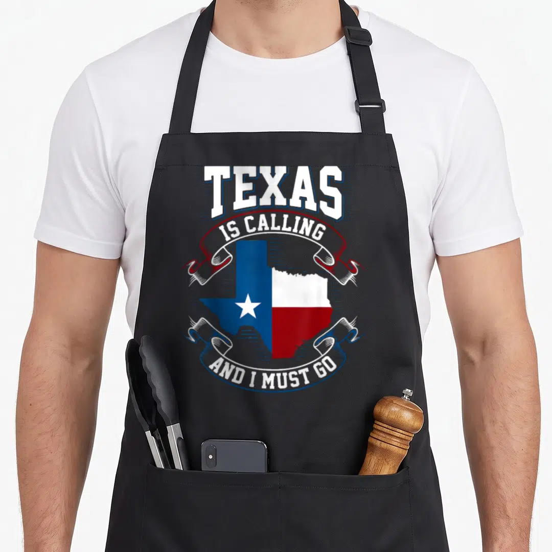 Calling texas apron - Texas map filled with flag colors and text on ribbons — shown on a black cotton canvas apron against a white background