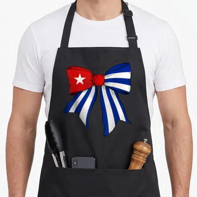 Cuba bow apron - Cartoon bow with red white star and blue white stripes — shown on a black cotton canvas apron against a white background