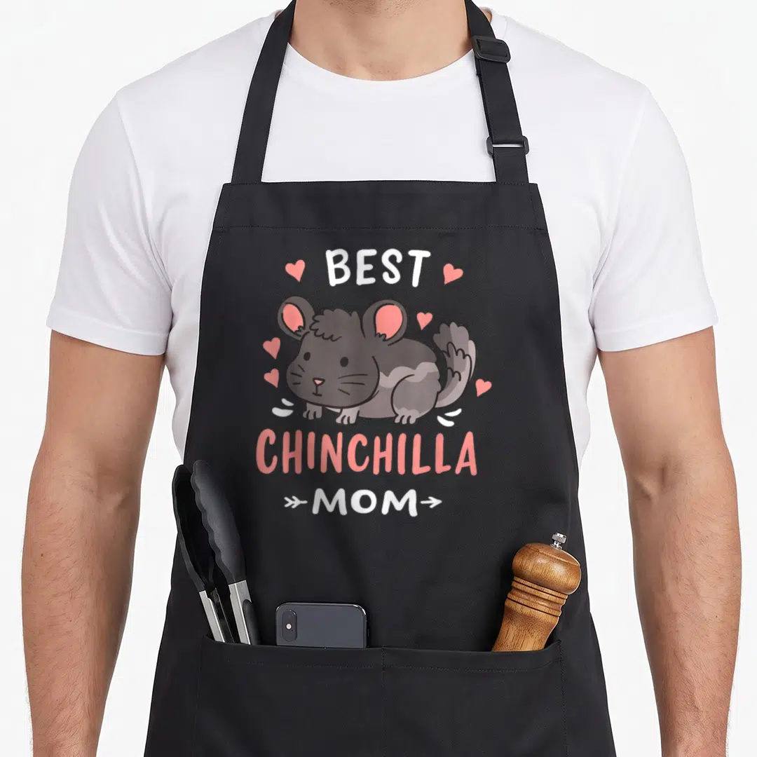 Cute chinchilla mother's day aprons - Best Chinchilla Mom text with grey cartoon rodent and pink hearts — shown on a black cotton canvas apron against a white background