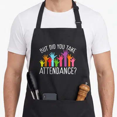 But officer squad apron - Arched text but did you take attendance above multicolored raised cartoon hands — shown on a black cotton canvas apron against a white background