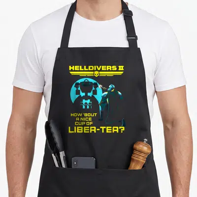 Helldiver tea apron - Soldier firing robot with Helldivers II logo and Liber-Tea pun text in yellow and blue — shown on a black cotton canvas apron against a white background