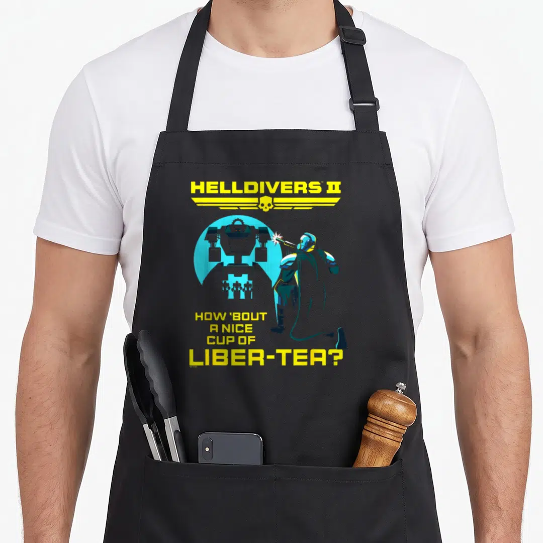 Helldiver tea apron - Soldier firing robot with Helldivers II logo and Liber-Tea pun text in yellow and blue — shown on a black cotton canvas apron against a white background