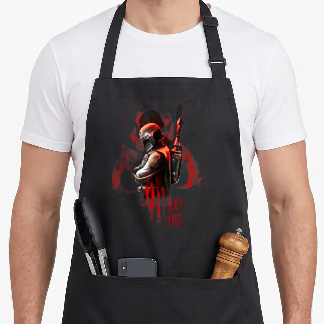 Box hunter apron - Boba Fett helmeted figure in red frame with blood splatter and stacked text — shown on a black cotton canvas apron against a white background