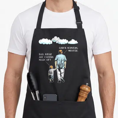 Cloud developer problems apron - Father and son walking under three clouds with speech bubbles about Linux servers — shown on a black cotton canvas apron against a white background