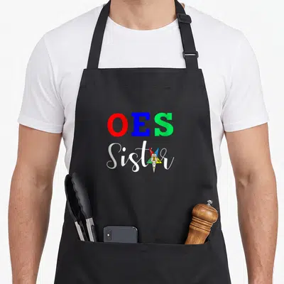 Eastern star oes apron - OES Sister text with red blue green five-pointed star emblem — shown on a black cotton canvas apron against a white background