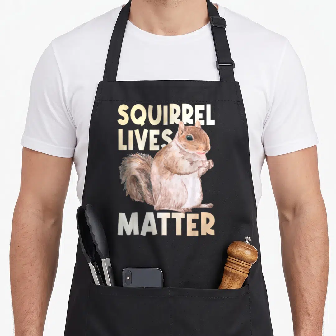 Matter squirrel aprons - Watercolor brown squirrel with SQUIRREL LIVES MATTER text in cream and white — shown on a black cotton canvas apron against a white background