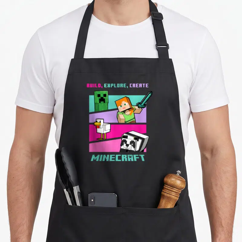 Build create an apron - Pixelated Alex, Creeper, chicken, and panda on colored stripes with BUILD EXPLORE CREATE — shown on a black cotton canvas apron against a white background