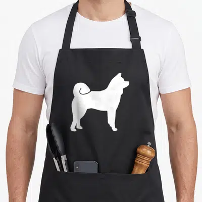 Cute akita apron - White silhouette of a standing Akita dog centered on grey background — shown on a black cotton canvas apron against a white background