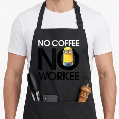 Despicable coffee apron - Minion character inside black letter O with white NO COFFEE and black WORKEE text — shown on a black cotton canvas apron against a white background